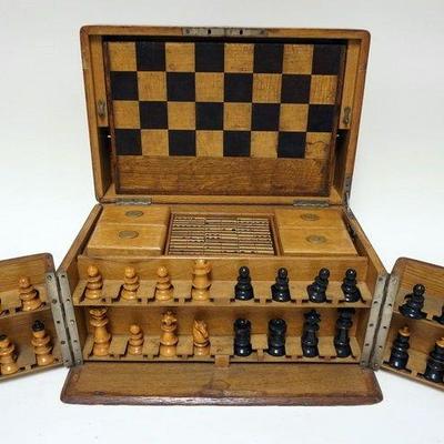 1208	ANTIQUE GAMING SET IN FITTED OAK CASE, CHESS, CHECKERS, BACKGAMMON AND MAHJONG, APPROXIMATELY 10 IN X 16 IN X 9 IN HIGH
