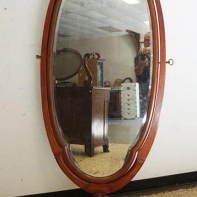 1121	MAHOGANY CHEVAL MIRROR ON PAW FEET, APPROXIMATELY 32 IN X 70 IN HIGH
