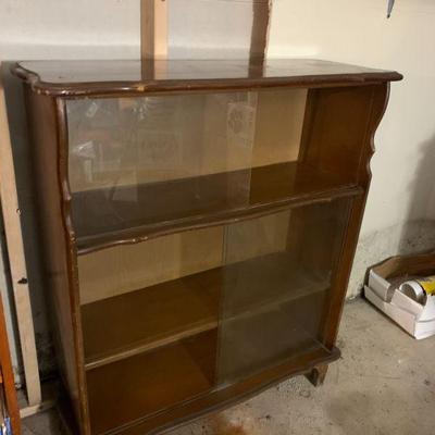 Book case with glass sliding doors