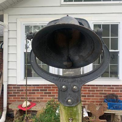 Large bell on post