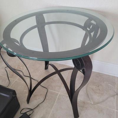 one of a pair of glass top end tables