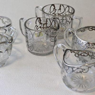 Antique and vintage sugar & creamer sets with silver overlay.