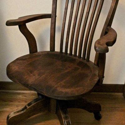 Vintage wood rolling office chair.