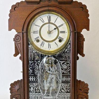Antique kitchen clock with walnut case.