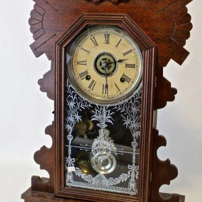 Antique Ansonia kitchen clock with walnut case.
