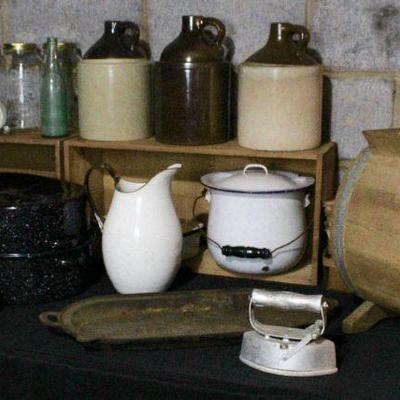 Goods from a bygone era - sad iron, enamel ware, cast iron griddle, canning jars - but, all can be used or repurposed today!