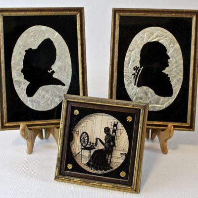 Reverse paintings on glass, including the 1930s silhouette of a Colonial lady spinning piece by Eileen Virginia Dowd.
