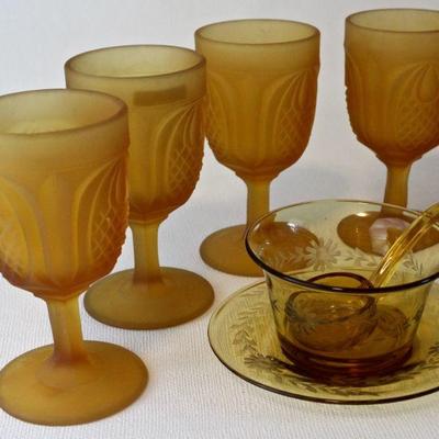 Frosted amber New England Pineapple pattern goblets, etched glass condiment dish, saucer, & spoon.