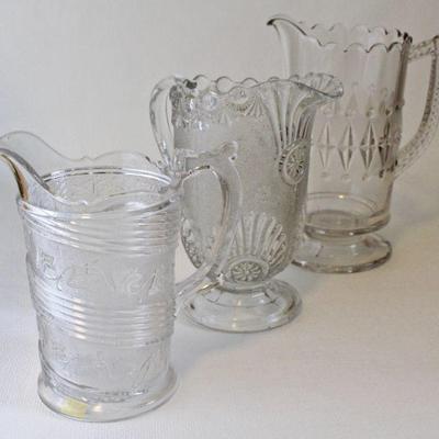 Early American Pattern Glass water pitchers.