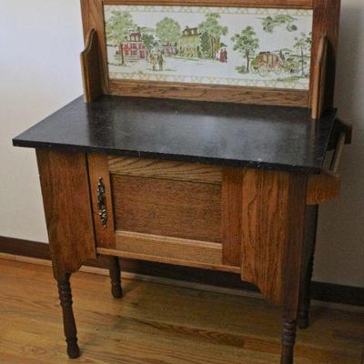 Antique oak washstand with marble top.