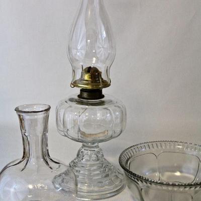 Glass oil lamp, water bottle, and serving bowl.