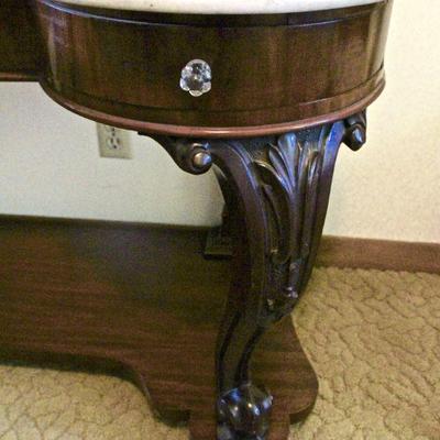 Detail - carved wood leg of hall table.