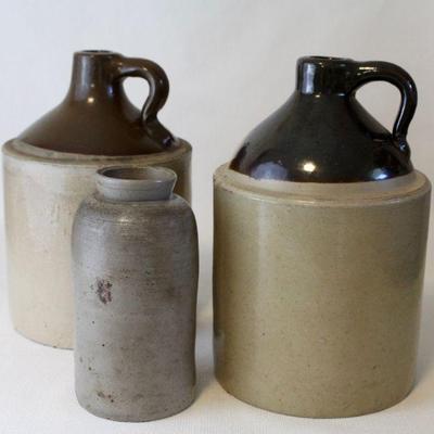 Collection of stoneware jugs and crocks.