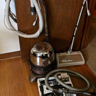 A superb machine - Rainbow vacuum cleaner with hard surface and carpet heads, hoses, and accessories.