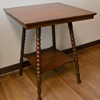 Fern stand with spool legs.