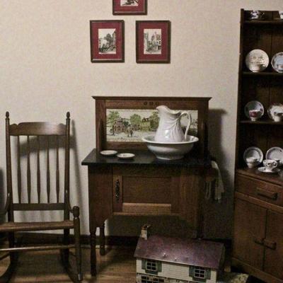 Antique rocking chair with rush seat, wash stand, pitcher & bowl set, corner cupboard with demitasse cups & saucers.
