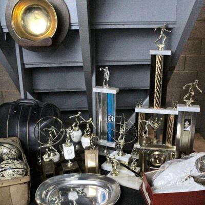 Duck pin bowling balls, bowling trophies, bowling shoes, and bowling ball bag.