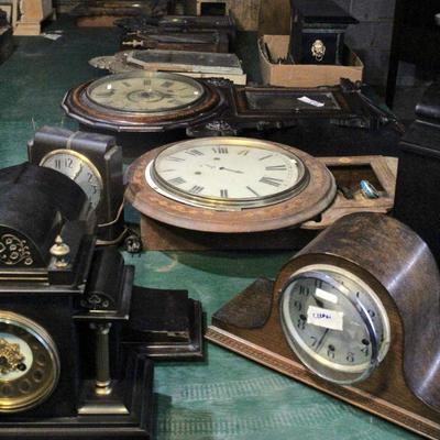 ... clocks of many shapes, designs, materials in various stages of restoration. 