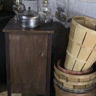 Small wood cabinet, tea kettle, peach & apple baskets.
