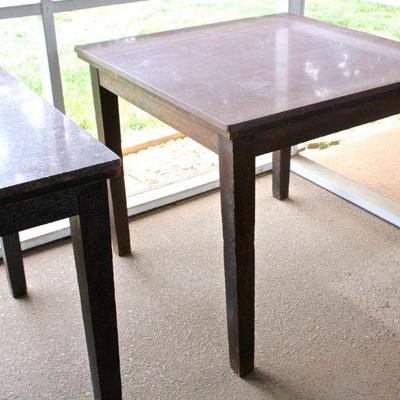 Three square marble top tables with wood bases.