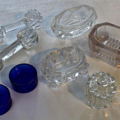 Larger salt cellars and knife rests.