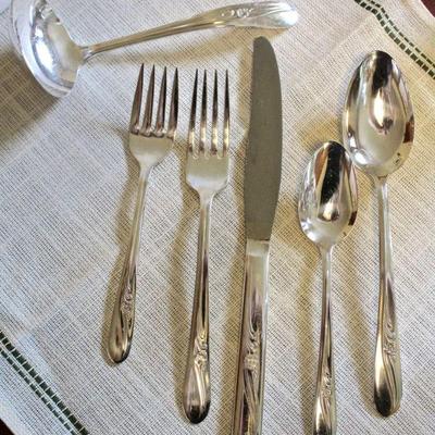5 piece place setting of "Meadow Flower" silver plate flatware by H&T Mfg. Co., plus ladle.