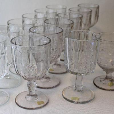Sets, pairs, & singles - EAPG goblets with grape motifs.
