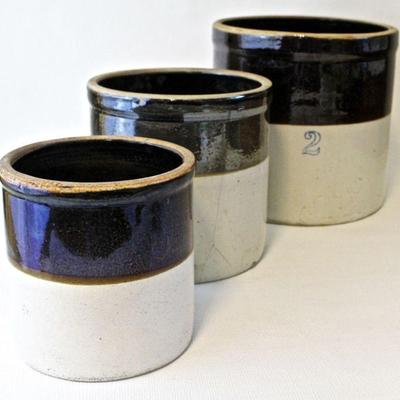 3 graduated size crocks.