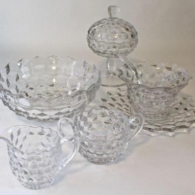 Fostoria American pattern serving bowl, sugar & creamer, covered candy dish, and condiment cup and saucer with glass spoon.