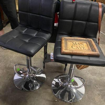 Pair of matching black leather bar stools 