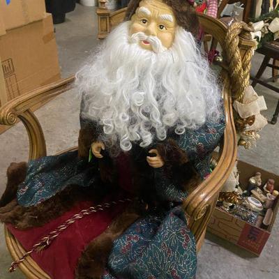 Santa in a vintage cane bottom swivel chair