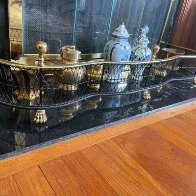 Antique black and gold fireplace fender