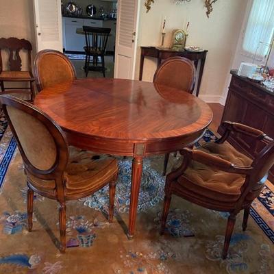 Rosewood dining table with velvet chairs
