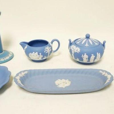 1136	7 PIECE LOT OF BLUE WEDGWOOD	7 PIECE LOT OF BLUE WEDGWOOD INCLUDING CANDLESTICKS, CREAM & SUGAR, TRAYS, TALLEST  IS APPROXIMATELY 6...