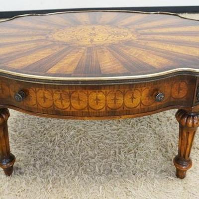 1029	2 DRAWER INLAID COFFEE TABLE W/SUNBURST PATTERN VENEER TOP, TOP FINISH HAS WEAR & ONE DRAWER KNOB IS MISSING, APPROXIMATELY 46 IN X...