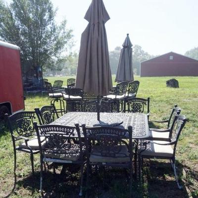1289	LARGE CAST METAL PATIO SET	LARGE CAST METAL PATIO SET WITH 8 ARM CHAIRS, UMBRELLAS AND LAZY SUSAN TABLE, TABLE APPROXIMATELY 60 IN X...