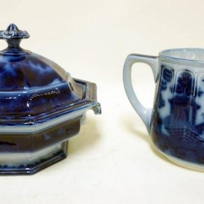 1167	FLOW BLUE COVERED TUREEN AND DOULTON PITCHER	FLOW BLUE COVERED TUREEN AND DOULTON ENGLAND PITCHER, LARGEST IS APPROXIMATELY 9  IN X...