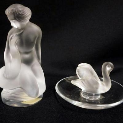 1159	2 LALIQUE FIGURES	2 LALIQUE FIGURES, NUDE WOMAN WITH SWAN AND SWAN RING DISH, LARGEST IS APPROXIMATELY 4 1/2 IN HIGH
