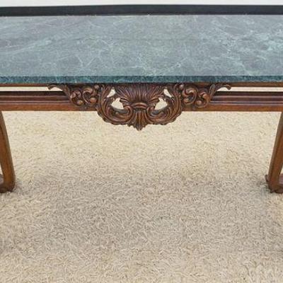1019	GREEN MARBLE TOP HALL TABLE W/A CARVED WALNUT CABRIOLE LEG, BALL & CLAW FOOT BASE, APPROXIMATELY 50 IN X 18 IN X 31 IN HIGH
