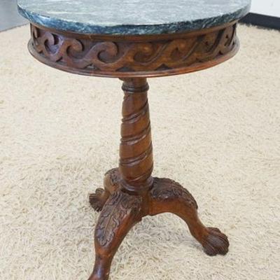1023	MAHOGANY PAW FOOT ROUND LAMP TABLE W/GREEN MARBLE TOP, APPROXIMATELY 18 IN X 28 IN HIGH
