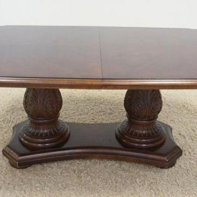 1003	BERNHARDT WALNUT DINING ROOM TABLE ON DOUBLE CARVED PEDESTALS W/2 LEAVES, APPROXIMATELY 79 IN X 45 IN X 30 IN HIGH, LEAVES ARE 18 IN
