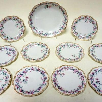 1196	LIMOGES 11 PIECE ICE CREAM SET	LIMOGES 11 PIECE ICE CREAM SET WITH 1 -9 IN MASTER BOWL AND 10 - 6 1/4 IN PLATES, 1 WITH SMALL RIM CHIP
