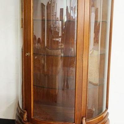 1012	BOW FRONT MAHOGANY CRYSTAL CABINET, HAVING BEVELED EDGE GLASS & GLASS SHELVES, APPROXIMATELY 47 IN X 20 IN X 79 IN HIGH
