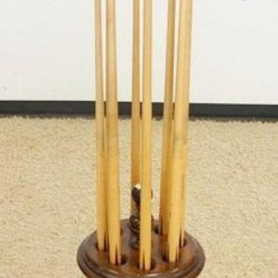 1034	POOL STICK HOLDER W/8 POOL STICKS, APPROXIMATELY 29 IN HIGH
