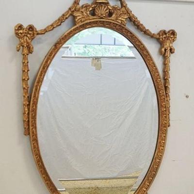 1006	OVAL BEVEL EDGE MIRROR IN GILT FINISH FRAME W/URN & DOUBLE BOW DESIGN, APPROXIMATELY 24 IN X 41 IN

