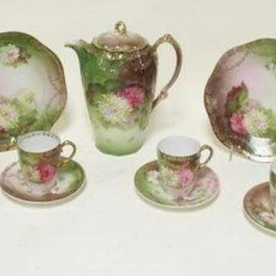 1198	ANTIQUE BAVARIAN CHINA TEA AND CAKE SET	ANTIQUE BAVARIAN TEA AND CAKE SET, TEA POT APPROXIMATELY 9 1/4 IN HIGH
