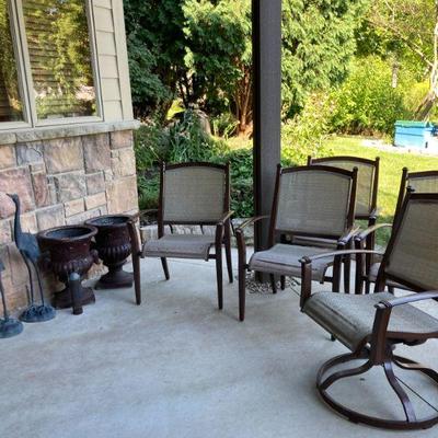 Patio chairs, urns, egrets