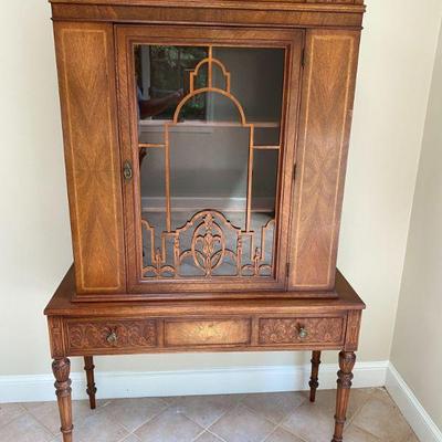 French step back china closet with fretwork panel. Silverware drawer beneath