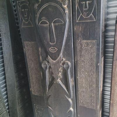 Another African cabinet, humanoid figural carvings and geometric reliefs, approximately 7 foot tall, two interior shelves, very good...
