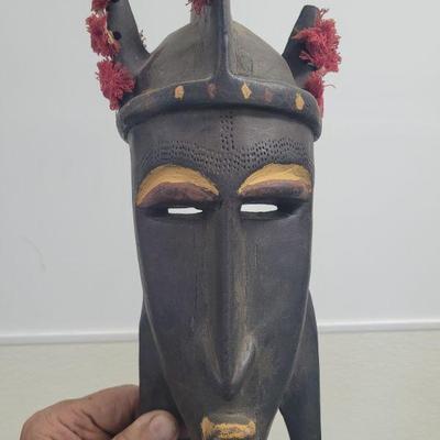 African hand carved modern Malian mask with fiber ornamentation, very good condition, measures approximately 14
